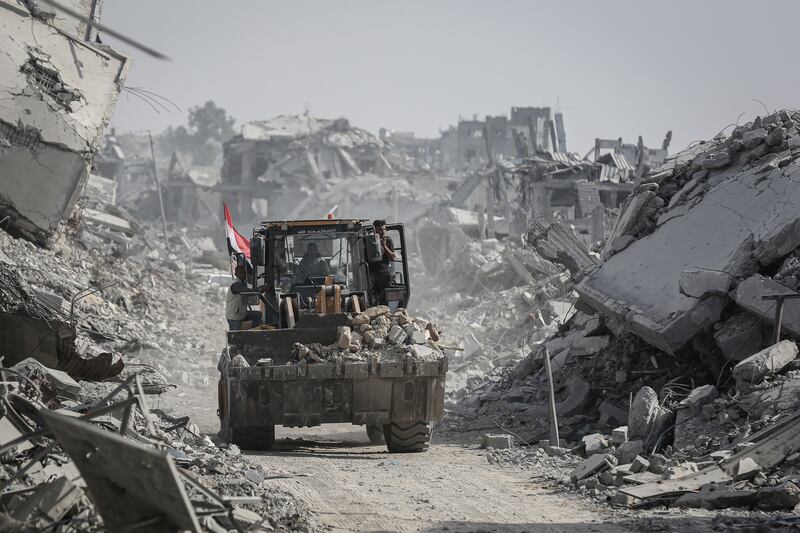 An Egyptian bulldozer moves rubble during a search for the bodies of Israeli hostages in eastern Gaza, on Sunday. Photograph: Ahmad Salem/Bloomberg