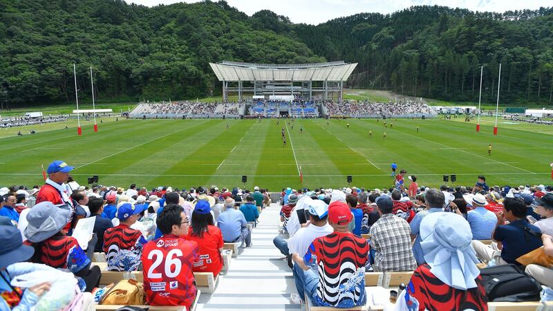Fans watch a legend match between Shinnittetsu Kamaishi and Kobe Steel at the Kamaishi Restoration Stadium on August 19th in Kamaishi, Iwate, Japan. The stadium will host two games during the Rugby World Cup next year. Photograph: Koki Nagahama/Getty Images