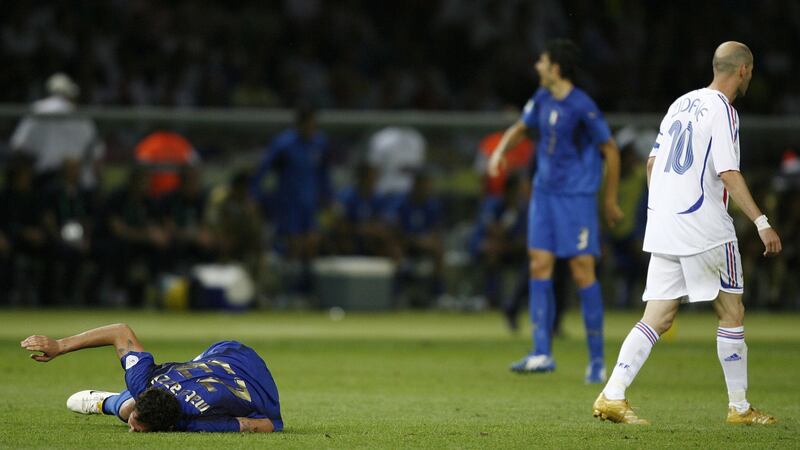 Zinedine Zidane   walks away after fouling  Marco Materazzi. Photograph:  Dylan Martinez/Reuters