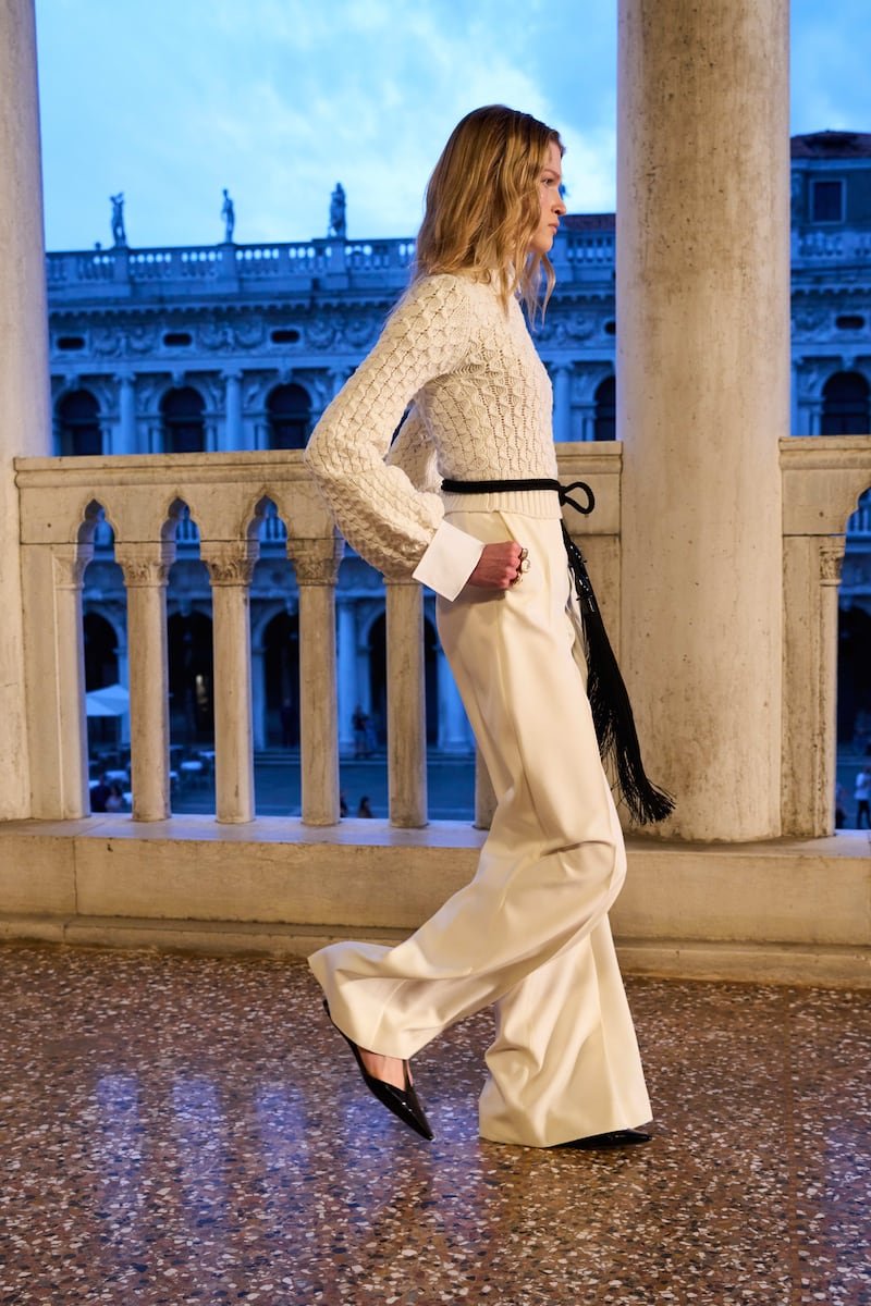 White knit cabled sweater, Elvira, €435, with collar and arm cuffs, €170
