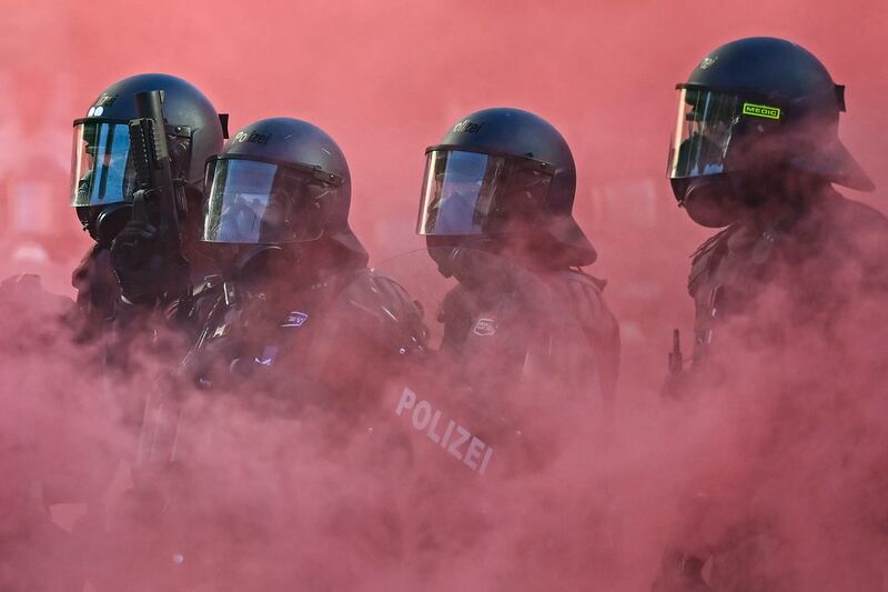 Police officers in riot gear during a 'no G7' rally in Geneva on Sunday in advance of this week's summit of world leaders.  Photograph: Fabrice Coffrini/AFP via Getty Images