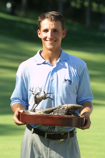 David Gossett holds the trophy after winning the 2001 John Deere Classic. Photograph: Scott Halleran/Allsport