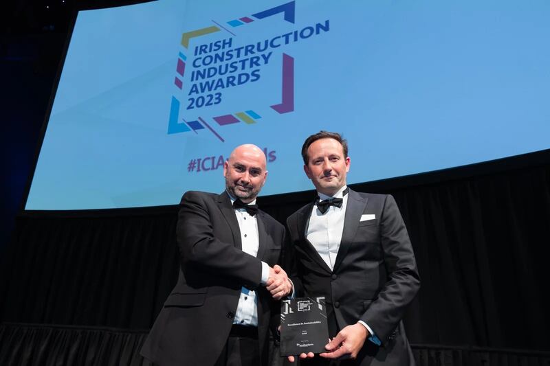 Barry Doyle, director, KSN project management, presents the excellence in health and safety award to Alasdair Henderson, BAM Ireland