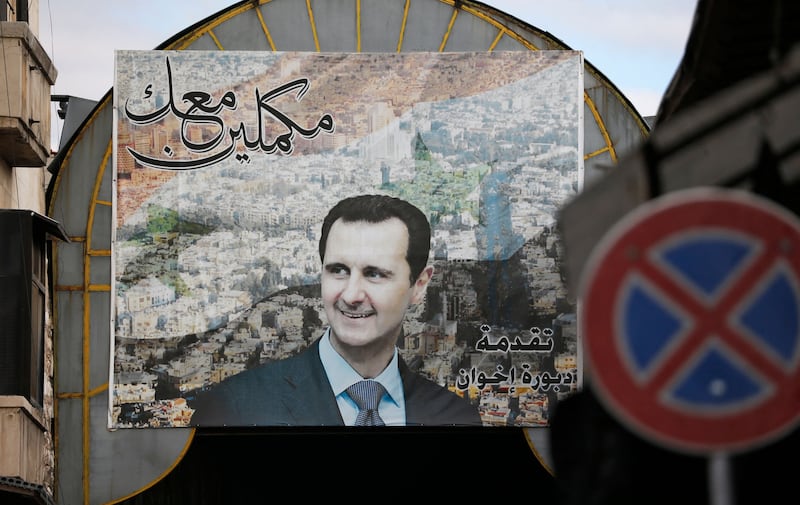A portrait of Bashar Assad in the old city of  Damascus in  2022. Photograph: Louai Beshara/AFP via Getty Images