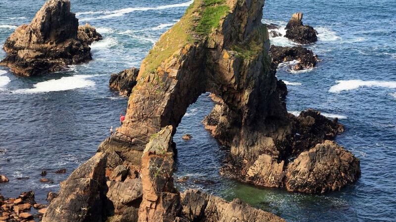 Niamh Gaffney with Iain Miller from Unique Ascent climbing the sea stack at Crohy head on the west coast of Donegal. Photograph: John Rafferty