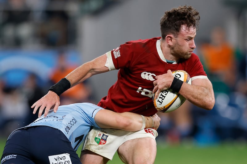 Hugo Keenan of the British and Irish Lions is tackled during the tour match. Photograph: Darrian Traynor/Getty