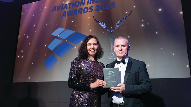Viktoriia Ivannikova, awards judging coordinator, presents the operational excellence in aviation award to Pat Foley, The Shannon Airport Group