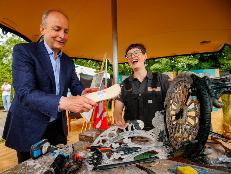 Taoiseach Micheal Martin and Nessa Doran O'Reilly, the furniture programme manager at the Rediscovery Centre in Ballymun, at Bloom festival in May. Photograph: Liam McBurney/PA Wire