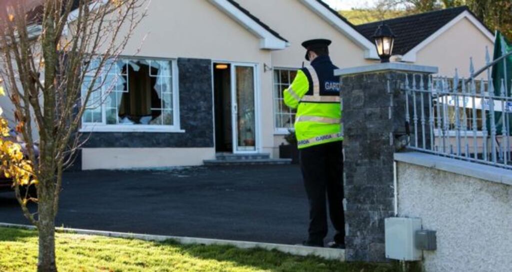 A Garda stands guard outside the house where a robbery happened in Killenaule Co Tipperary. Photograph: Brian Gavin/ Press 22