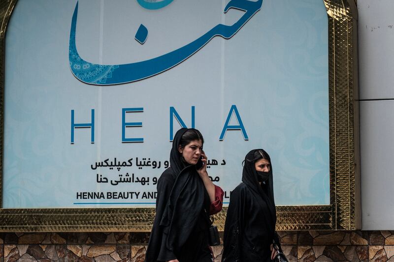 Women walks past a beauty salon at the Shahr-e Naw area in Kabul on Tuesday. Photograph: Wakil Kohsar/AFP via Getty Images