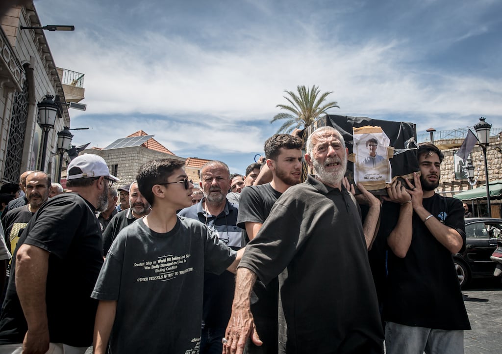 Mourners carry the coffins of the Abdallah family, six of whom who were killed by Israeli airstrikes on Monday. Photograph: Sally Hayden