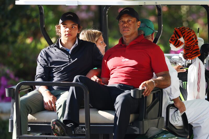 Tiger Woods and his son Charlie Woods depart the practice area during the final round of the 2024 Masters. Photograph: Andrew Redington/Getty