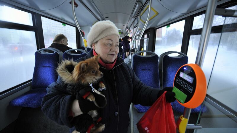 A woman and her dog avail of the free bus service in Tallinn, Estonia. Photograph:   Raigo Pajula/AFP/Getty Images