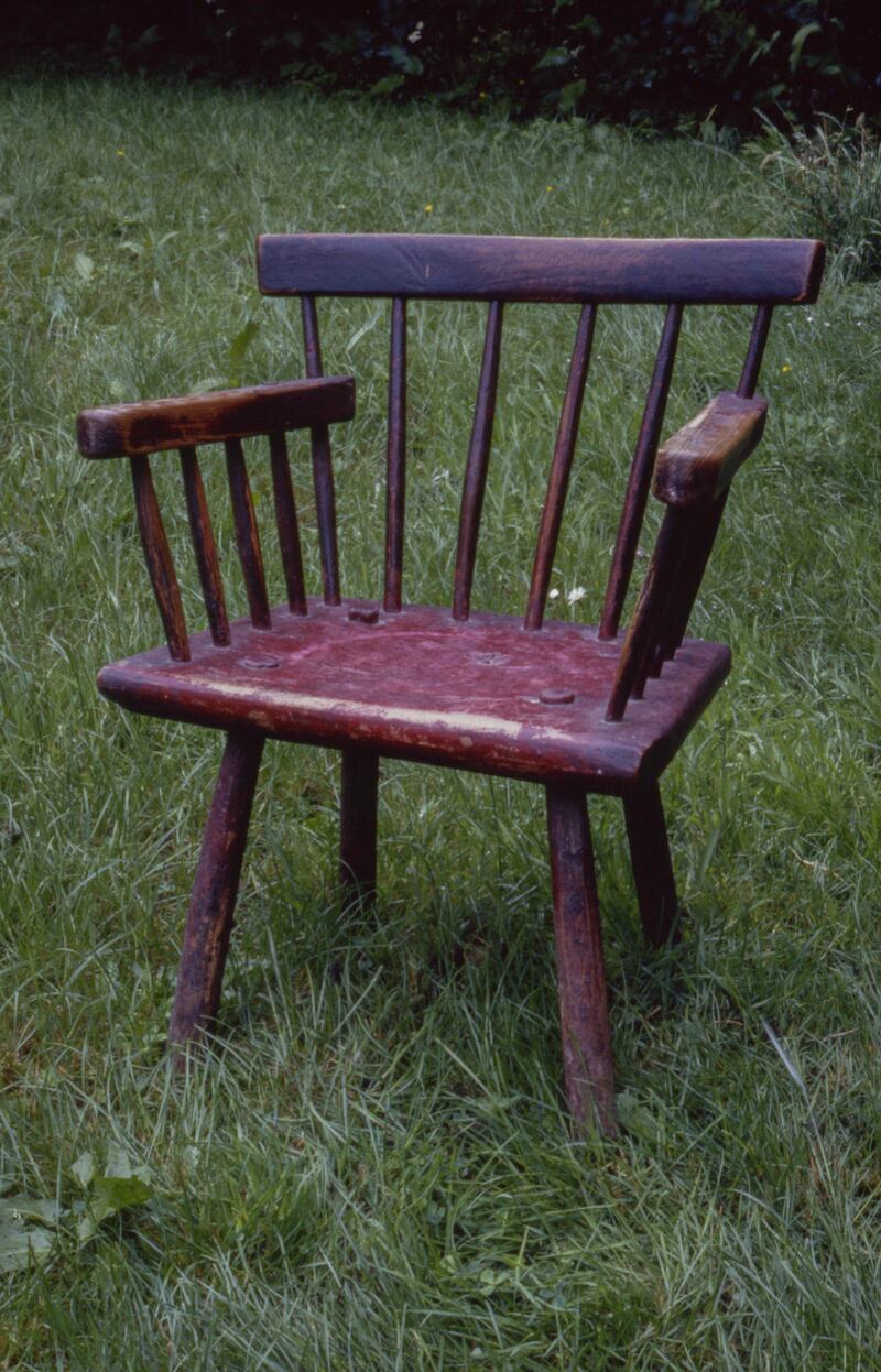 ‘Hedge chair’ incorporating several different woods, unified by red paint. By wheelwright Thomas Murphy, late 19th century: its stretcher-less legs deliberately allowed for easy replacement. Photograph: Claudia Kinmonth, Co Wicklow, 1988