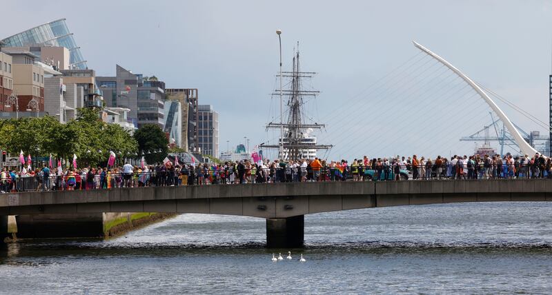 The parade makes its way over the Liffey, crossing the Millennium Bridge. Photograph: Alan Betson/The Irish Times

