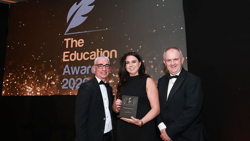 Joe Collins, awards judge, presents the best student experience award to Charles Smith and Órlaith McLaughlin, Certified Irish Angus