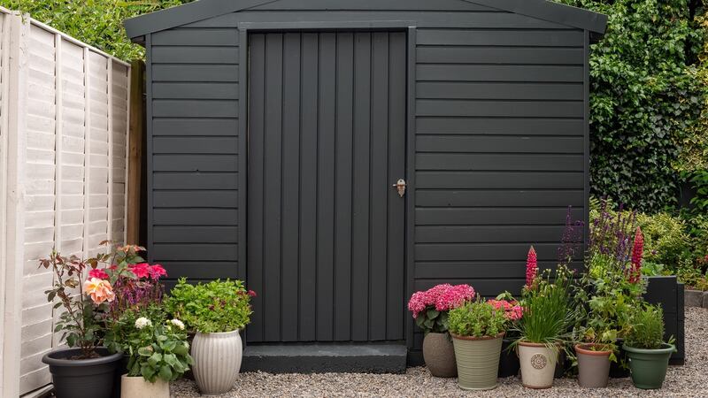 Shed painted in chic dark grey called Dark River from Colourtrend.