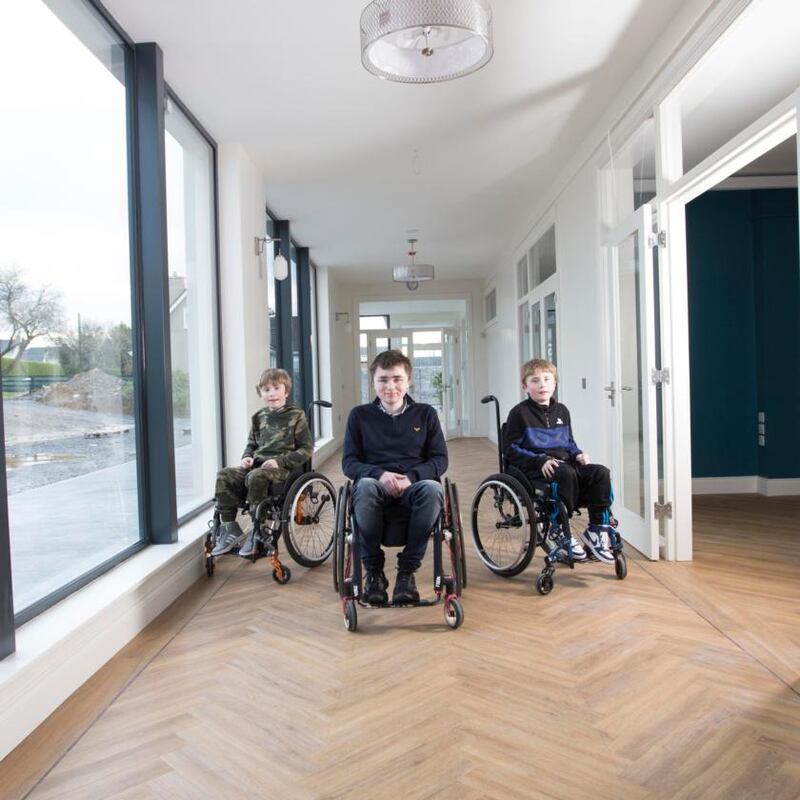 George, Archie and Isaac have an extra wide hallway to their bedrooms which allows three wheelchairs pass without crashing into each other. Photograph: Brian Farrell