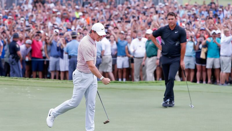 McIlroy fist pumps after sinking his putt for birdie on the 18th green. Photo: Erik S. Lesser/EPA
