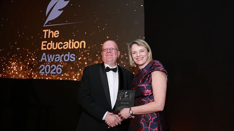 Martin O'Connell, awards judge, presents the best research project award to Nicola Mountford, Maynooth University