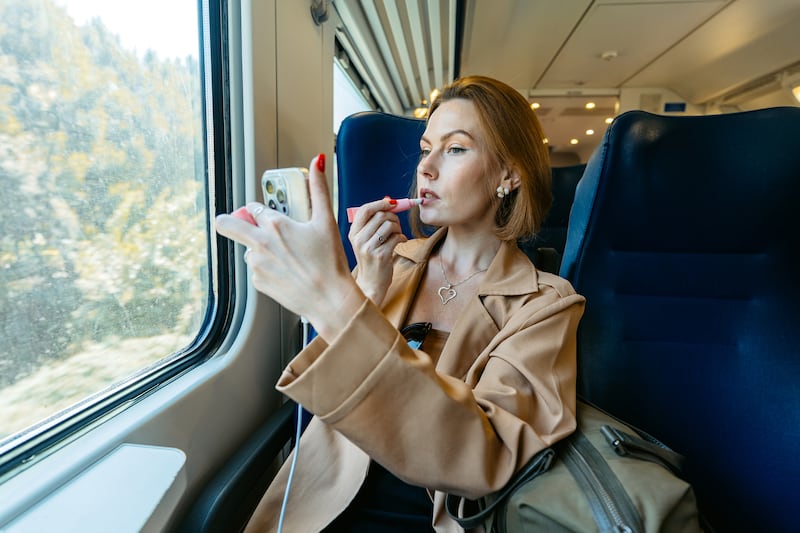 A quick lipstick refresh, or an elegant pat with a powder compact is 'probably okay'. Photograph: iStock