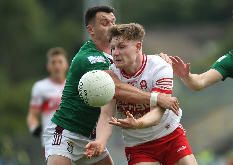 Westmeath's David Lynch tackling Ethan Doherty of Derry in Pairc Esler, Newry, Armagh. Photograph: Bryan Keane/Inpho