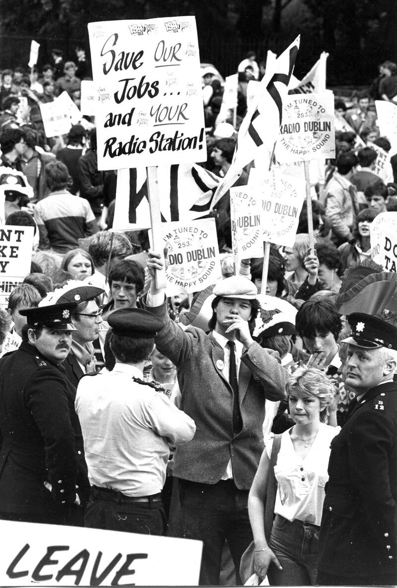 Pirate radio fans march in protest following the raid on Radio Nova, Kiss FM and Sunshine arriving at Government Buildings, May 1983. Photograph: Peter Thursfield
