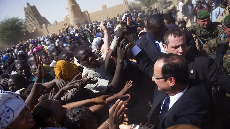 France’s then president Francois Hollande is gretted by locals in Timbuktu  on February 2nd, 2013. Photograph:  Fred Dufour/AFP via Getty Images
