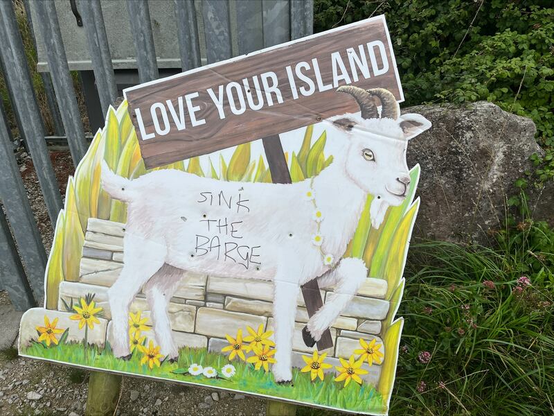 Graffiti protesting against the Bibby Stockholm barge on a sign on the Verne hilltop overlooking the vessel and  Portland town. Photograph: Mark Paul