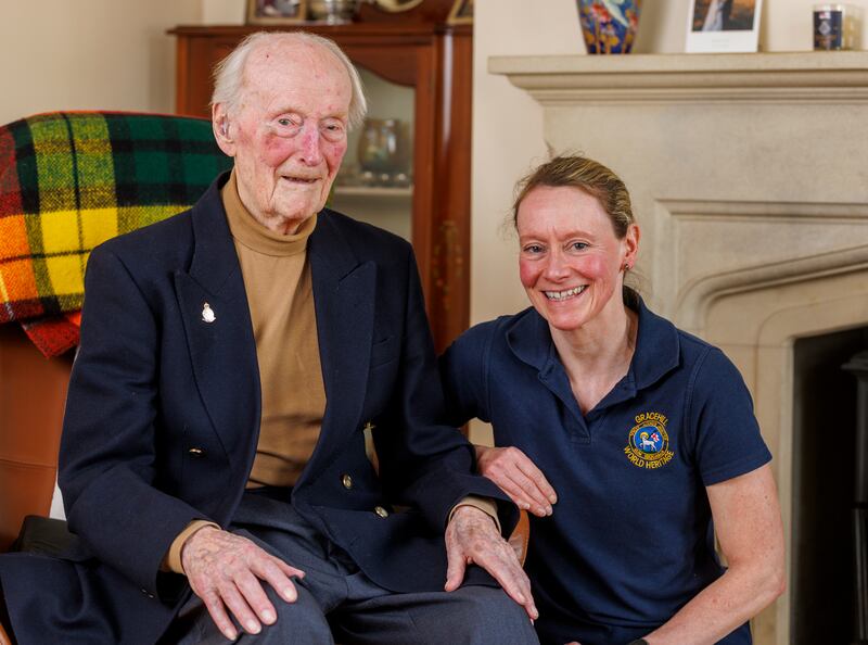 Royal Navy veteran George Spencer with his daughter Sally Ann Johnston at his home in Gracehill, Ballymena, ahead of his 100th birthday. Photograph: Liam McBurney/PA Wire