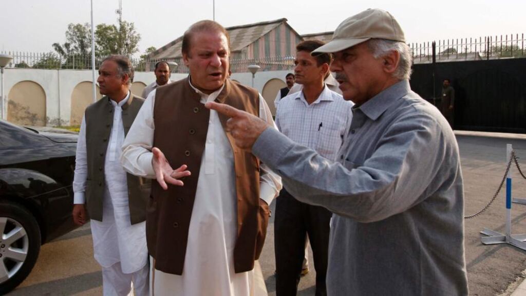Nawaz Sharif (front left), leader of Pakistan Muslim League - Nawaz, speaks with his brother Shahbaz Sharif, former chief minister of Punjab, in Lahore. Photograph: Reuters/Mohsin Raza