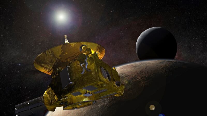 An illustration made available by Nasa shows an artist’s concept of the New Horizons spacecraft as it approaches Pluto and its largest moon, Charon.