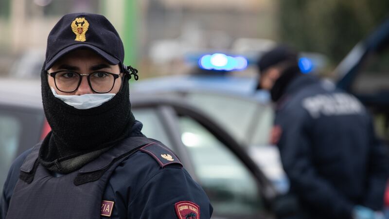 A police officer looks on at a checkpoint  in Milan. The Italian Government has imposed a  nationwide lockdown, limiting people to move only for work or health reasons, in an effort to fight the  coronavirus outbreak. Photograph:  Emanuele Cremaschi/Getty Images