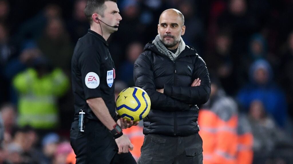Pep Guardiola stares at referee Michael Oliver as he walks onto the pitch for the second half of the Liverpool v Man City game at Anfield. Photograph: Laurence Griffiths/Getty Images
