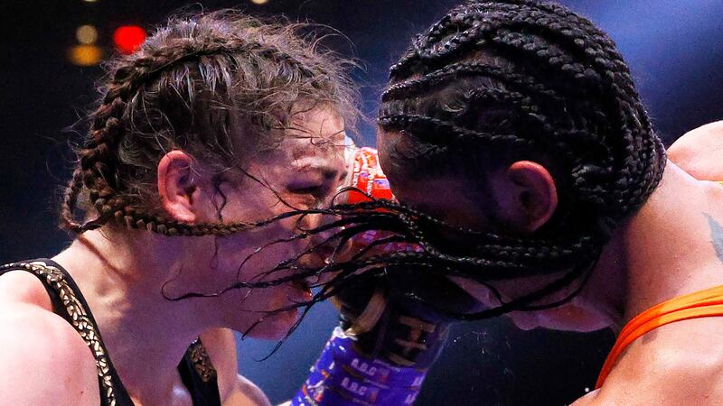 Katie Taylor trades punches with Amanda Serrano at close quarters during their World Lightweight title fight at Madison Square Garden in New York. Photograph: Sarah Stier/Getty Images