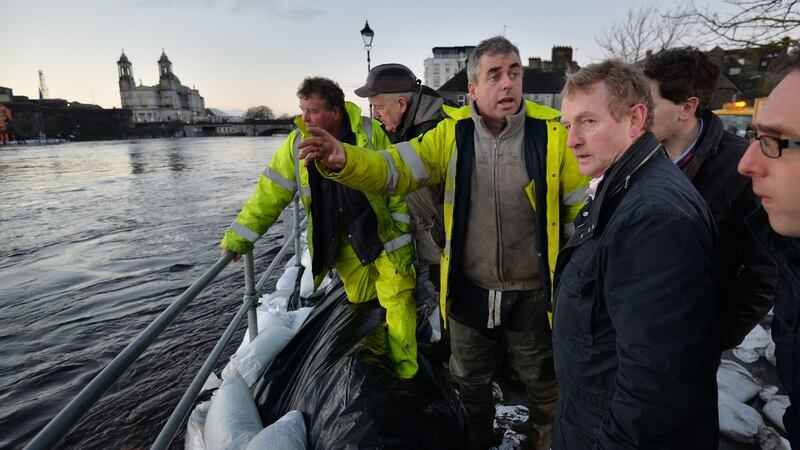 Cllr Kevin ‘Boxer’ Moran with Taoiseach Enda Kenny on the banks of the East side of the river Shannon in Athlone. Photograph: Alan Betson / The Irish Times