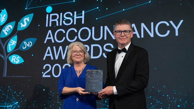 Rosemary Keogh, chief executive of Chartered Accountants Ireland, presents the outstanding contribution to accountancy award to Tom Ryan, Chartered Accountants Ireland