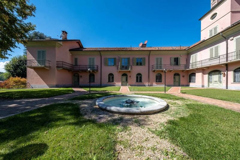 Three-bedroom apartment in Torino has a private garden and shares a swimming pool, tennis court and chapel. 