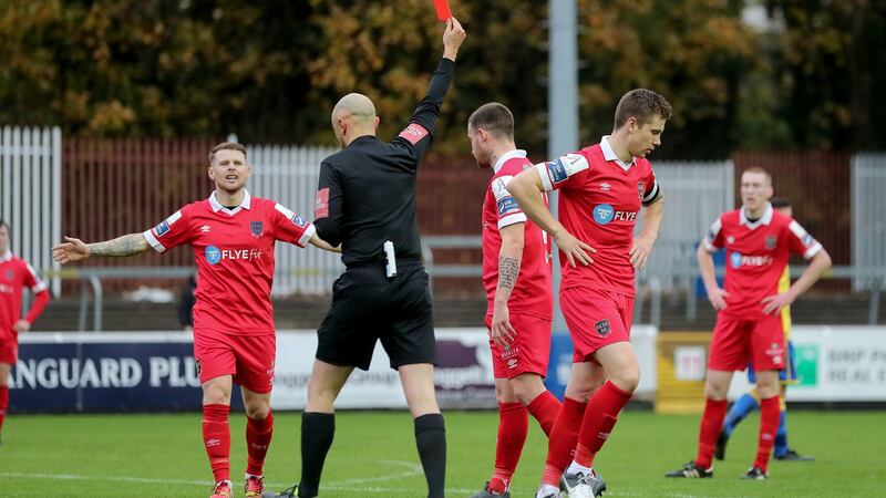 Shelbourne’s Luke Byrne receives a red card for his tackle on Rob Manley. Photograph: Bryan Keane/Inpho