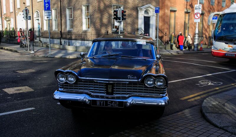 Limerick TD Richard O’Donoghue  arrives at the 1st meeting of the 33rd Dáil at Leinster House  in a  1953 Plymouth car. Photograph: Gareth Chaney/Collins