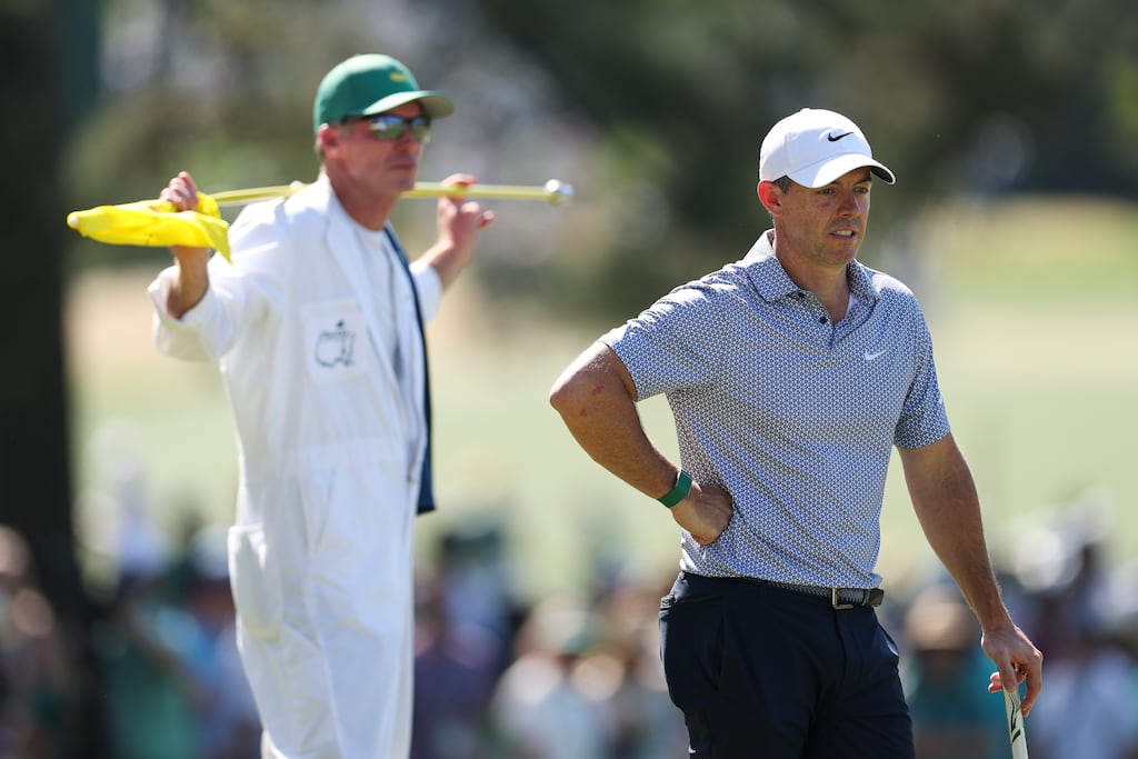 Rory McIlroy and his caddie Harry Diamond look on from the seventh green. Photograph: Maddie Meyer/Getty