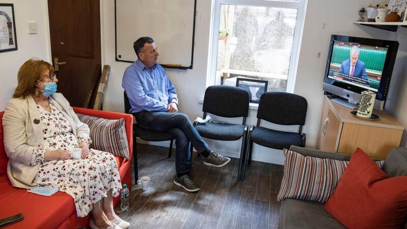 Briege Voyle, daughter of Joan Connolly, and John Teggart, son of Daniel Teggart, sit together at Springhill Community House to watch Northern Ireland Secretary Brandon Lewis make a statement  on Ballymurphy to the House of Commons. Photograph:  Brian Lawless/PA Wire