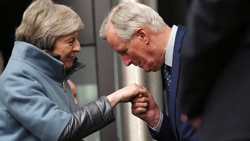 Chief European Union  Brexit negotiator Michel Barnier kisses the hand British prime minister Theresa May as she arives at the European Parliament in Strasbourg on Monday night. Photograph: Patrick Seeger/EPA.