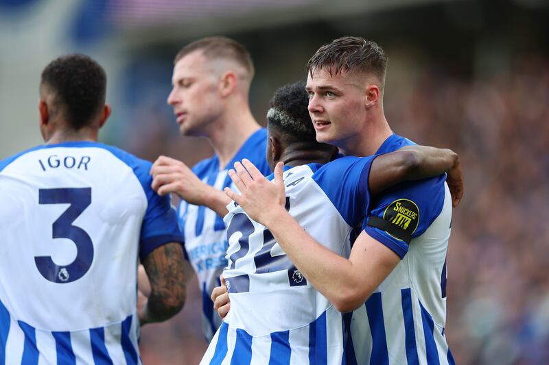 Evan Ferguson of Brighton celebrates his goal against Fulham with teammate Simon Adingra. Photograph: Tom Dulat/Getty Images