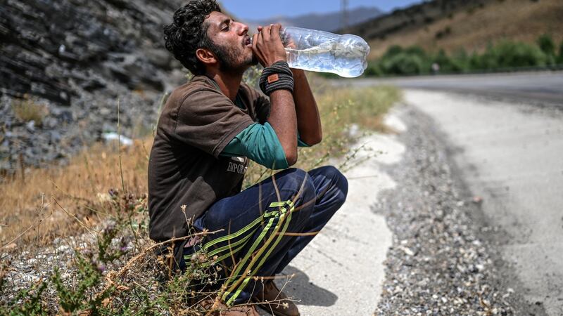 An Afghan migrant  on a roadside on August 15th in Tatvan, on the western shores of Lake Van, eastern Turkey. Photograph: Ozan Kose/AFP via Getty Images