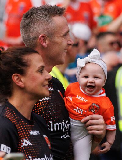 Armagh's Ciaron O’Hanlon with his daughter, Bobbie, after the final against Galway in 2024. Photograph: INPHO/Tom Maher