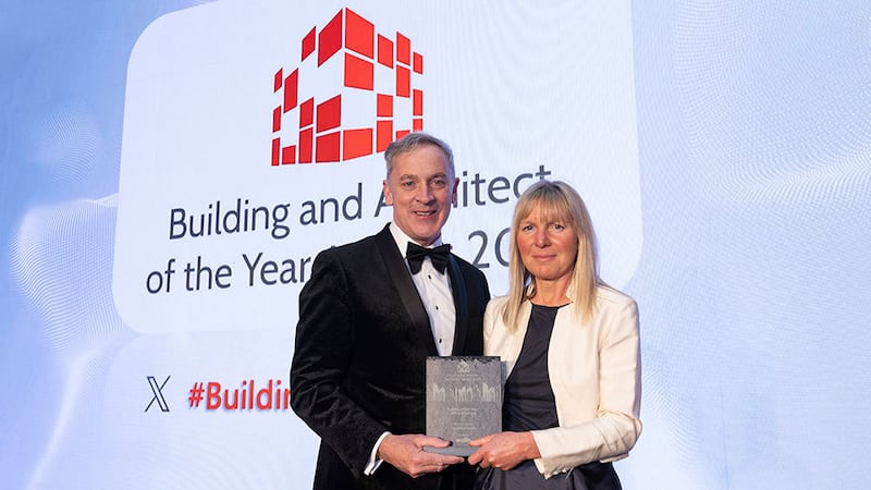 Barry Hennessy, director, business development & marketing, presents the building of the year - office (medium) award to Sarah O'Keeffe, Henry J Lyons