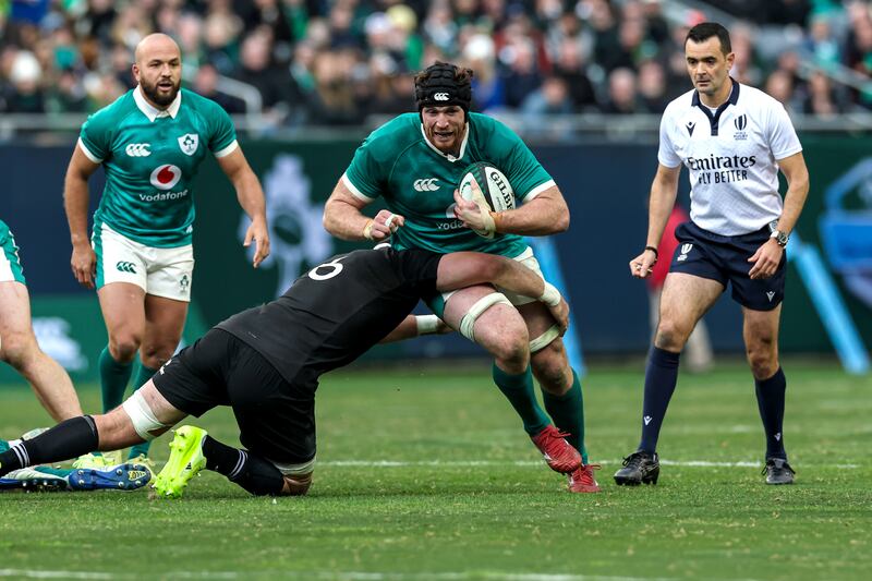 Ireland's Ryan Baird is tackled by Simon Parker of New Zealand . Photograph: Gary Carr/Inpho