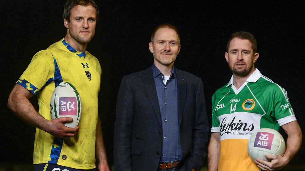 Brian Keating, AIB group propositions and brands director, with Michael Murphy (left) and Shane Williams, who feature in ‘The Toughest Trade’. Photograph: Ramsey Cardy/Sportsfile.