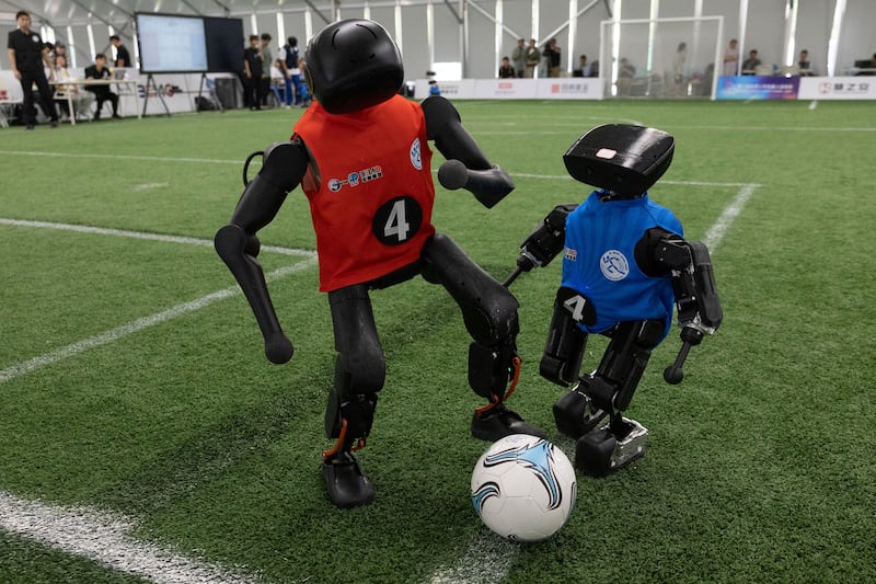 Humanoid robots in a football match at the 2026 World Humanoid Robotic Games in Beijing. Photograph: EPA